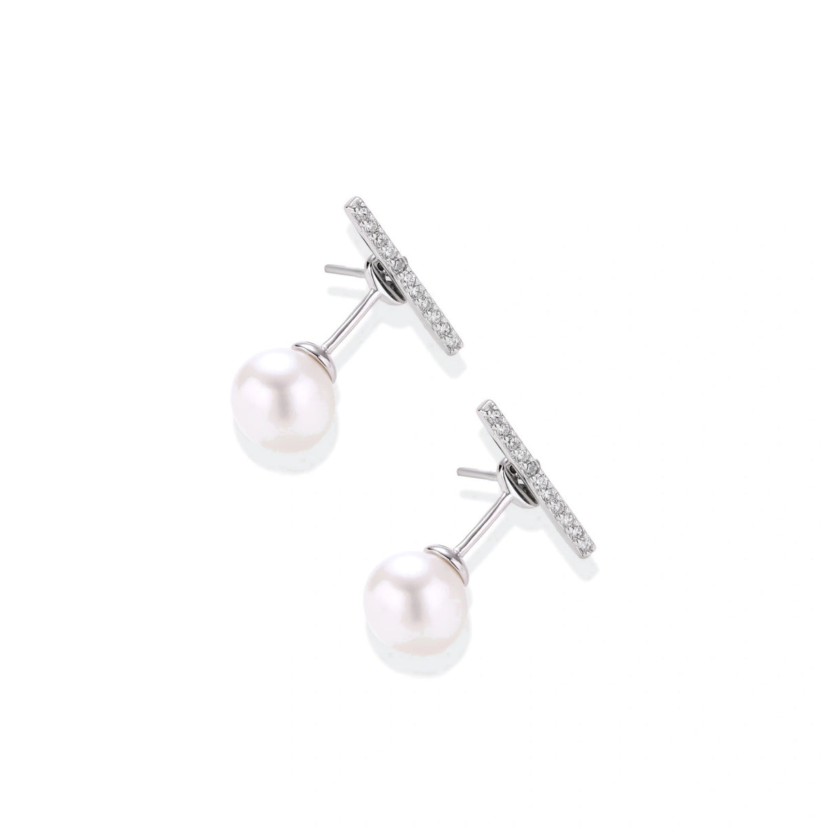 Romy Pearl Bar Ear Jackets, pair angled to show the posts and the pearl on the ear-jacket backing