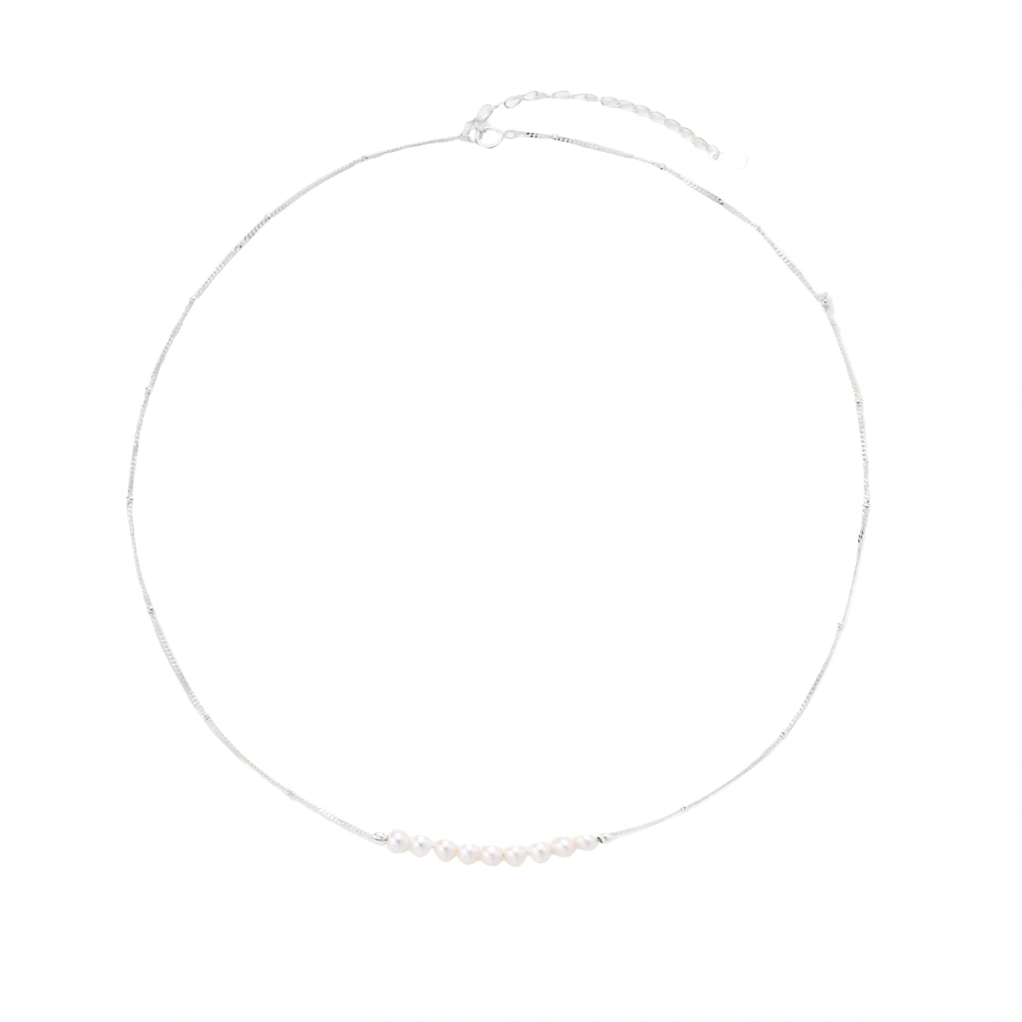 Silver necklace with small pearls on a white background