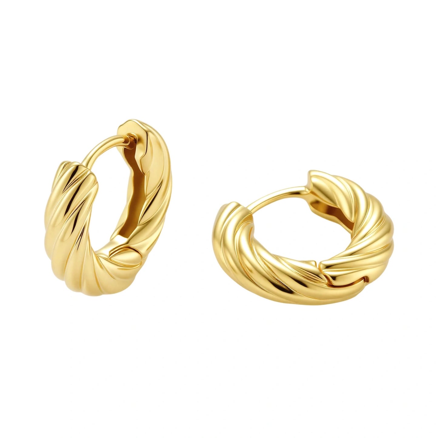 twisted gold huggie hoops on a white background