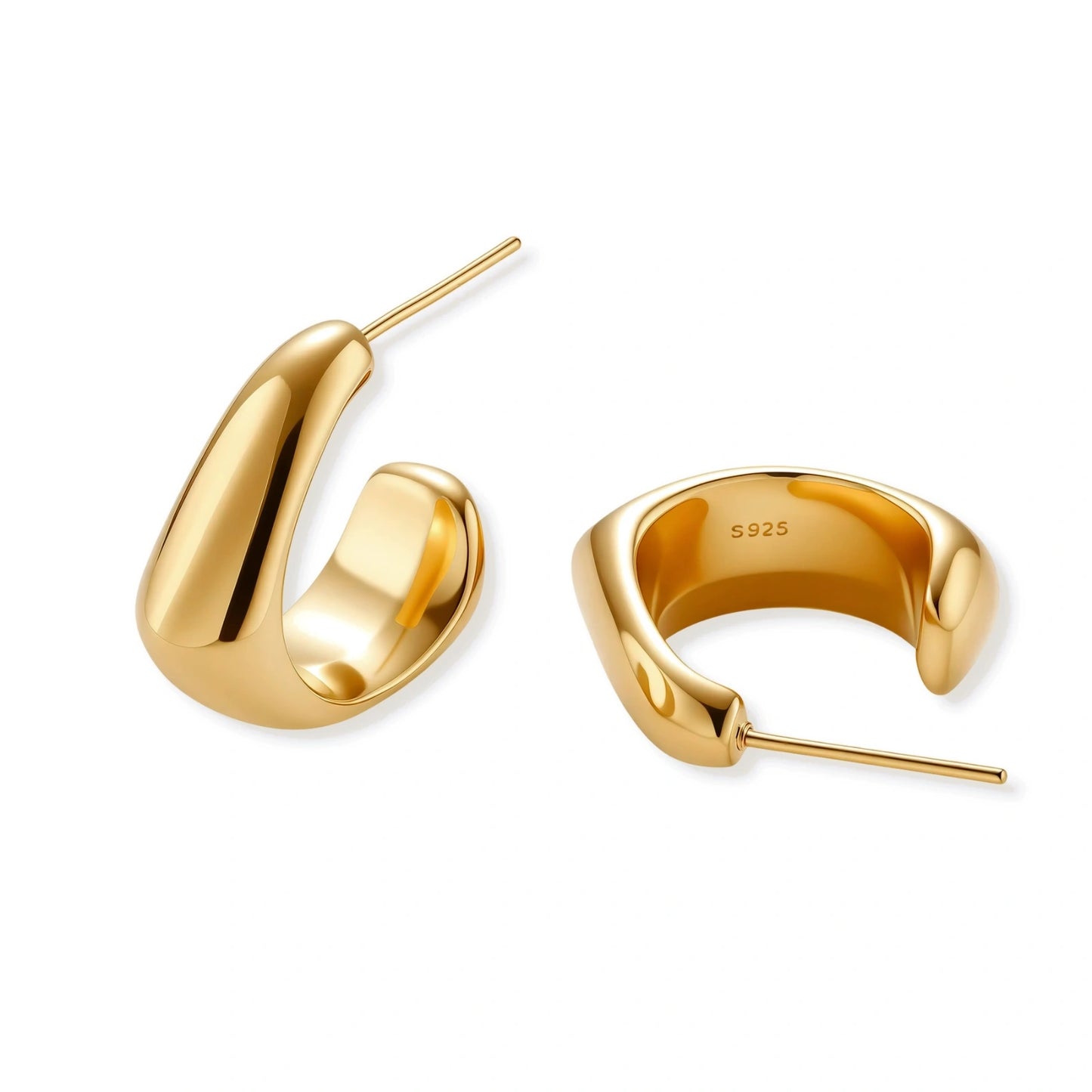 Gold hoop earrings on a white background