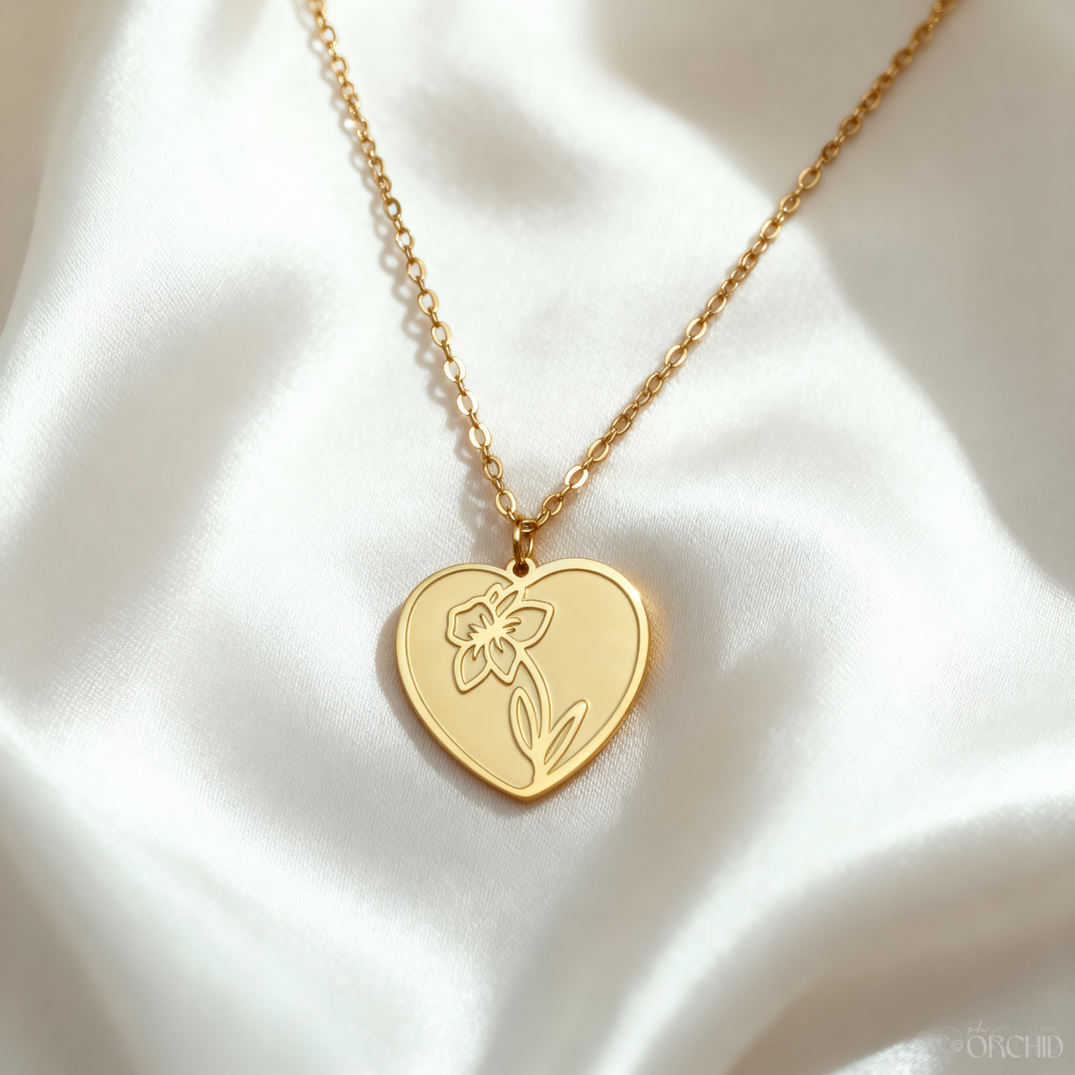 Gold heart birth-flower pendant necklace from Oh Orchid