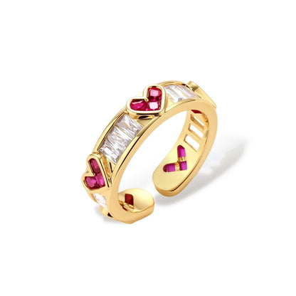 Coraline Heart Baguette Ring, gold ring with baguette zirconia and pink heart-cut stones, front view