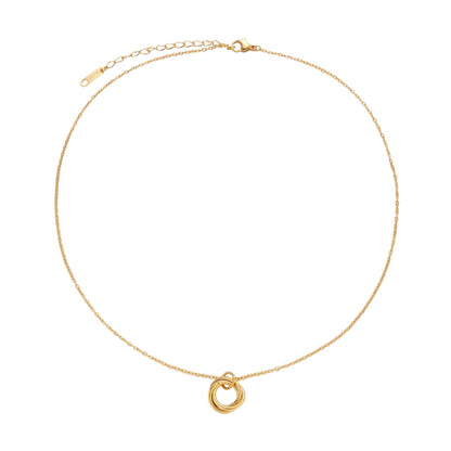 Gold necklace with a small ring pendant on a white background