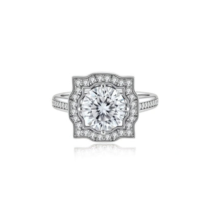 Adele Crown Moissanite Ring, front view of the round moissanite inside a scalloped pavé halo