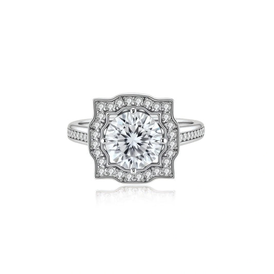 Adele Crown Moissanite Ring, front view of the round moissanite inside a scalloped pavé halo