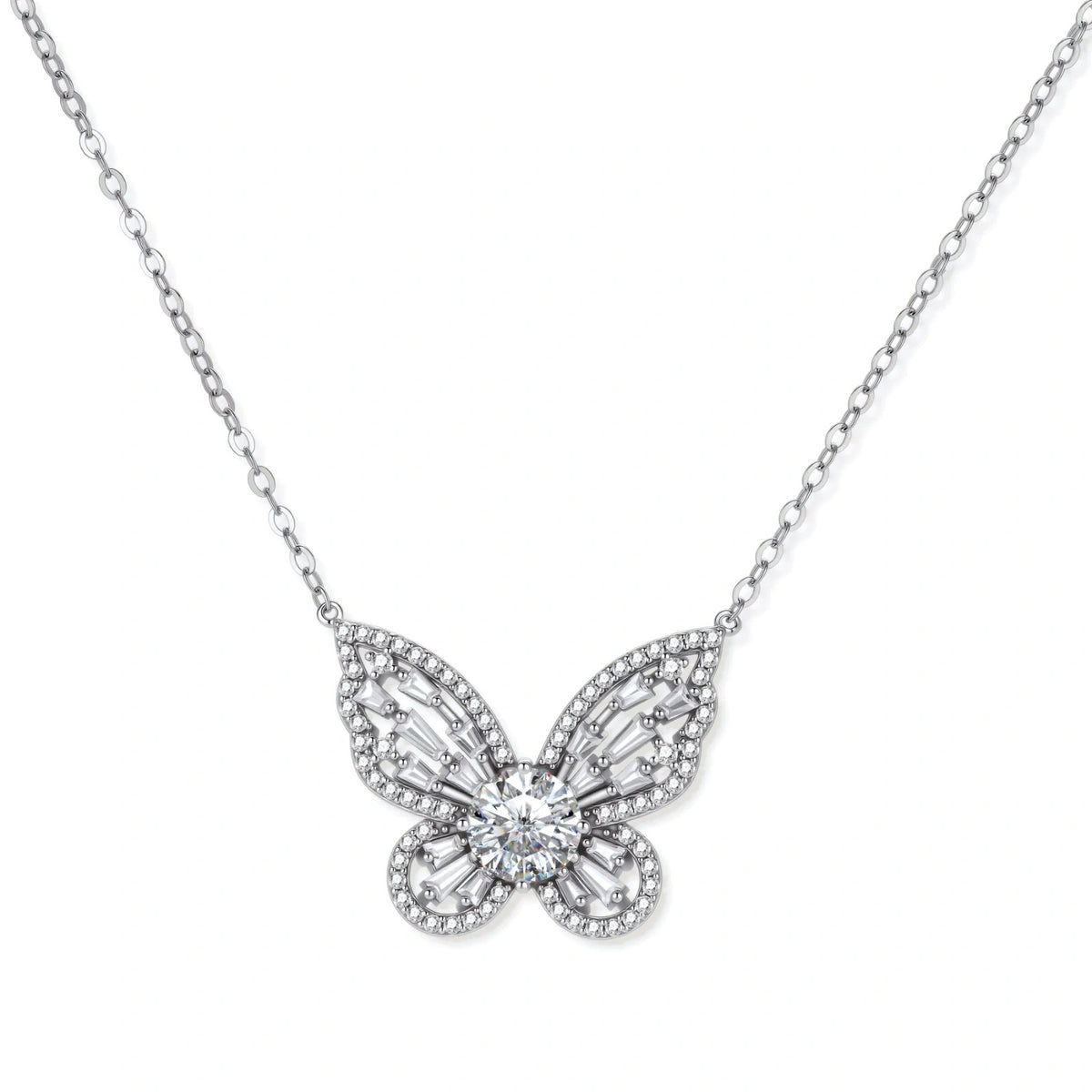 Iris Butterfly Moissanite Necklace, openwork butterfly pendant with a round moissanite centre and baguette-set wings on a fine chain, front view