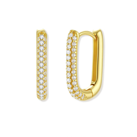 Gold hoop earrings with clear gemstones on a white background
