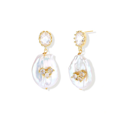 Moonlight Pearl Drops, front view of gold-plated crown studs suspending flat baroque pearls