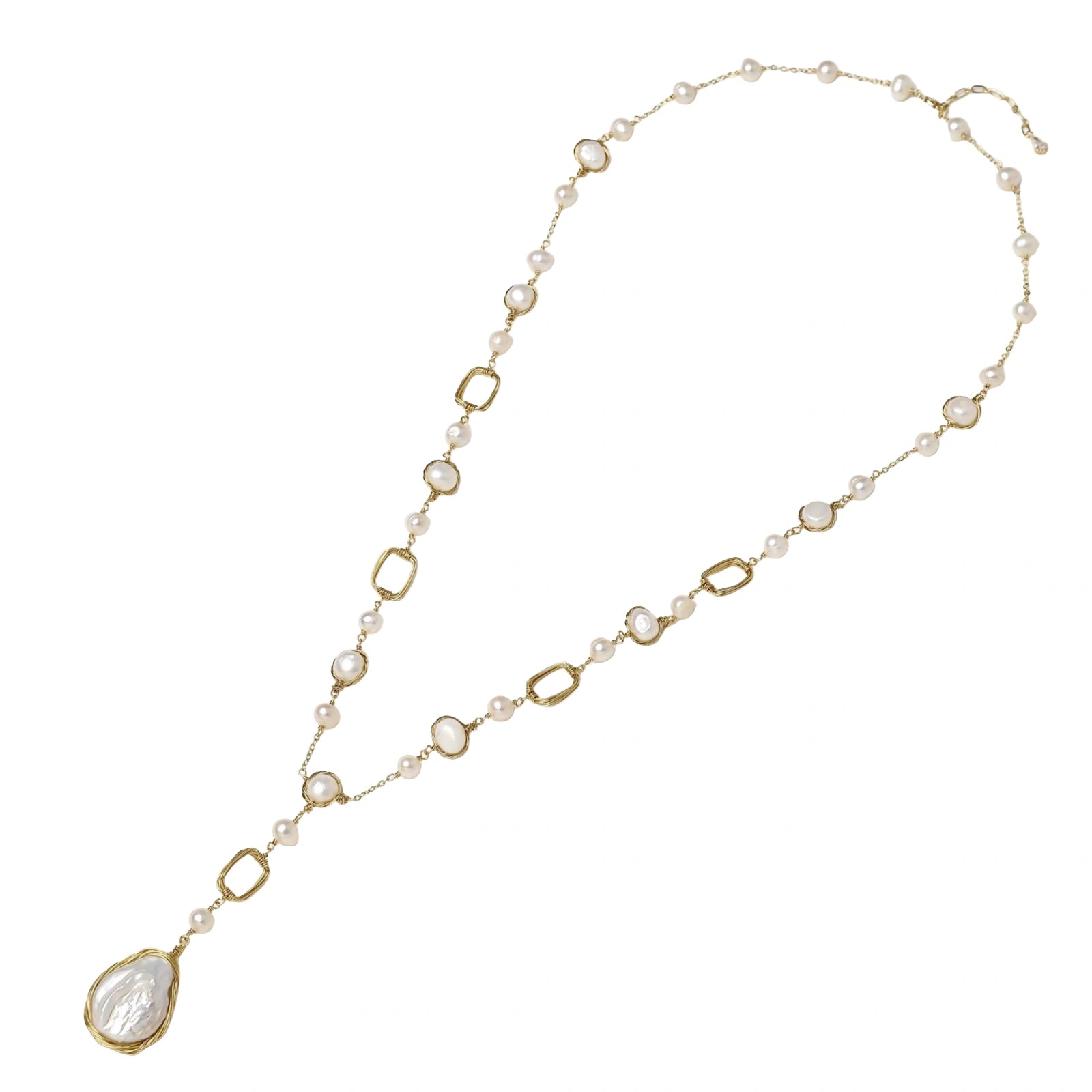 Necklace with gold and pearl links on a white background
