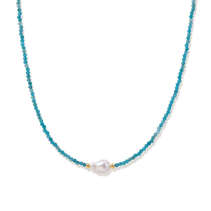 Skye Apatite Pearl Necklace, fine strand of faceted teal apatite beads with a single white freshwater pearl and gold spacer beads, front view