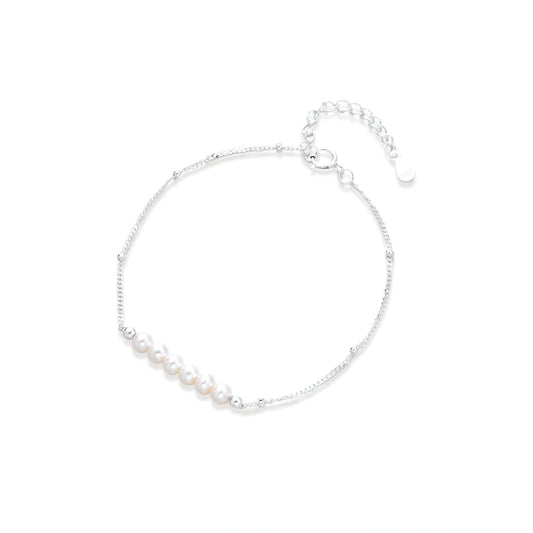 Anais Pearl Chain Bracelet, fine silver beaded chain bracelet with a row of six small white pearls, laid flat showing the clasp and extender