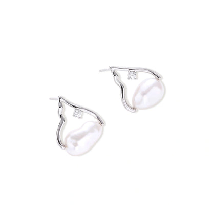Willa Pearl Arch Earrings, pair lying at an angle showing the post backs