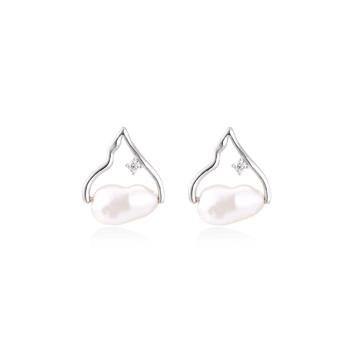 Willa Pearl Arch Earrings, pair side by side showing the peaked arch frames above the pearls