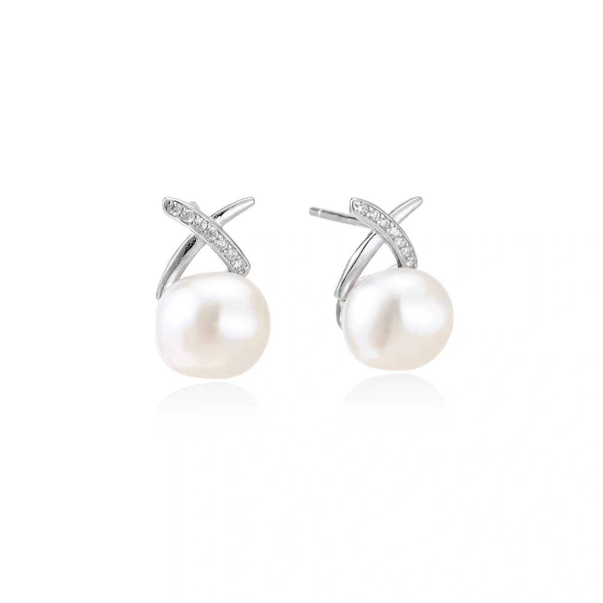 Ivy Crossover Pearl Studs, pair of silver crossover stud earrings with a round white freshwater pearl, one front-on and one turned to show the post