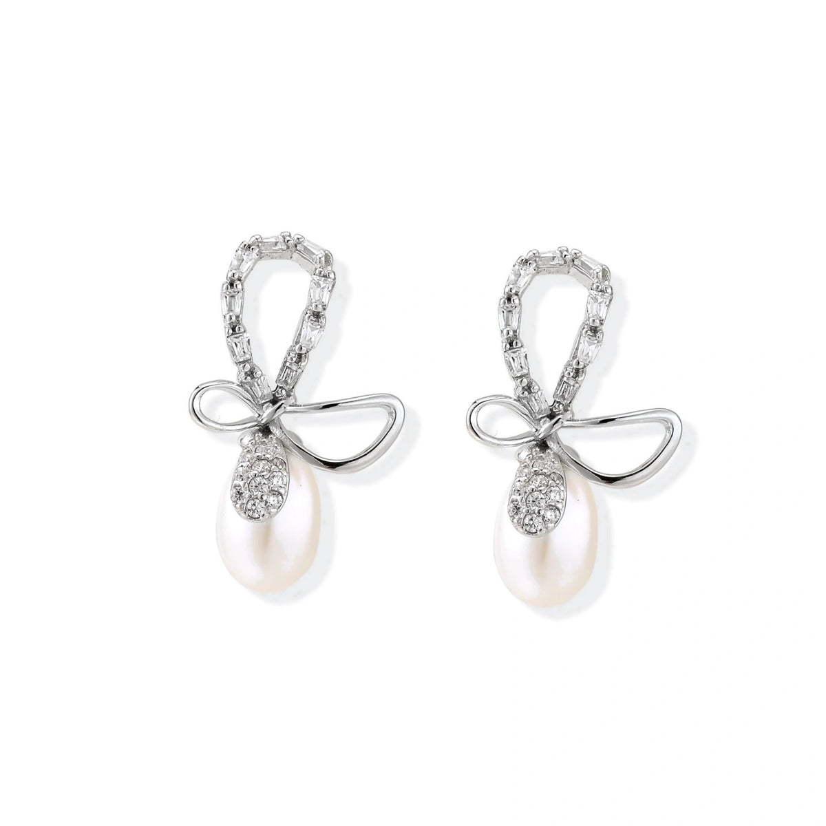 Bettina Bow Pearl Drops, pair of bow and pearl drop earrings, front view at a slight angle