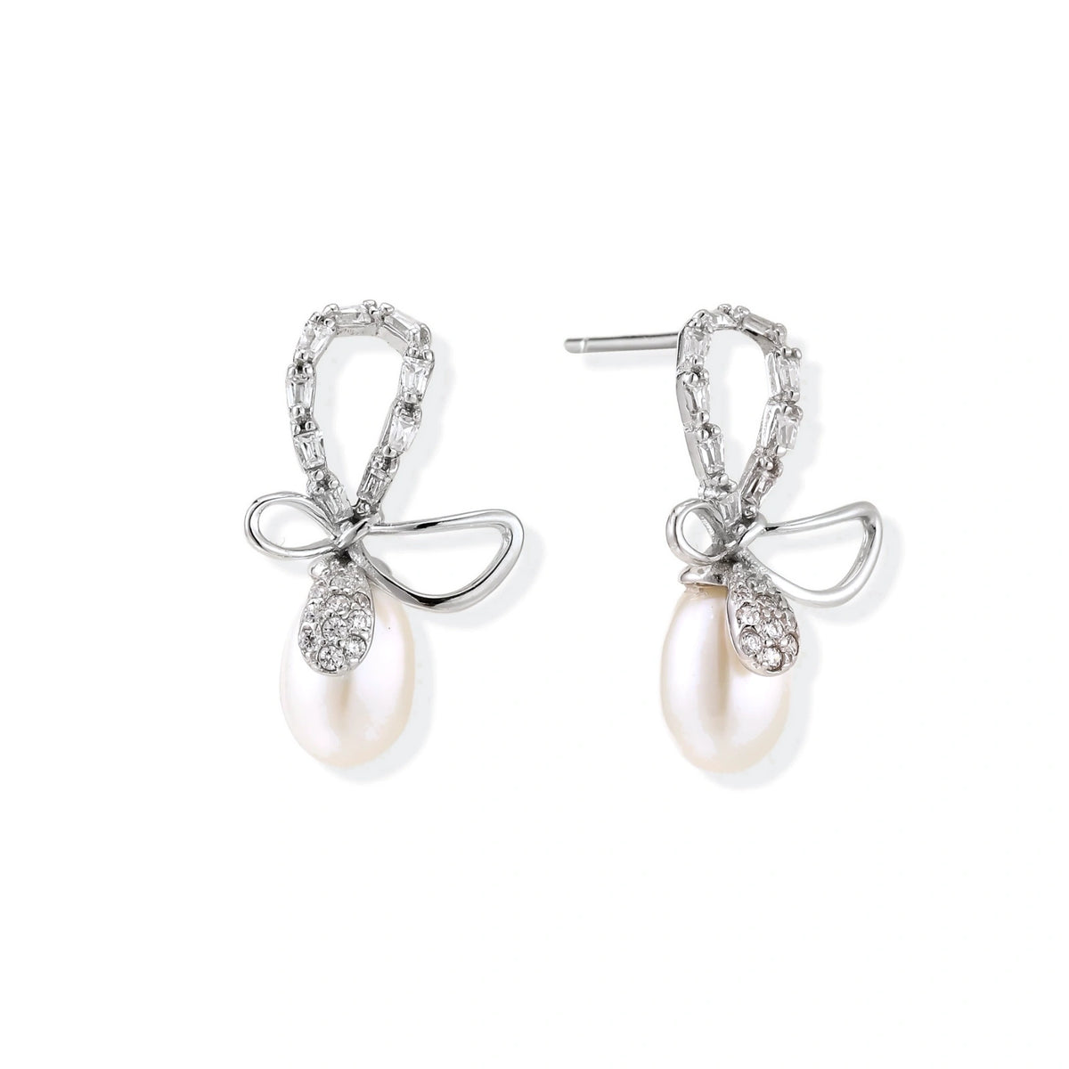 Bettina Bow Pearl Drops, pair of rhodium sterling silver bow earrings, one bow loop set with clear stones and the other polished, each with a freshwater pearl drop, front view