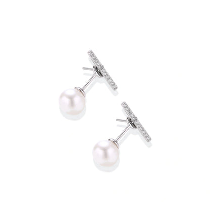 Romy Pearl Bar Ear Jackets, pair angled to show the posts and the pearl on the ear-jacket backing