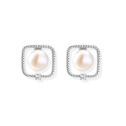 Greta Pearl Frame Studs, pair front-on showing the pearl inside each frame and the small corner stone