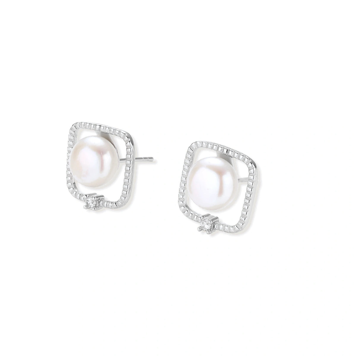 Greta Pearl Frame Studs, pair lying at an angle showing the post backs