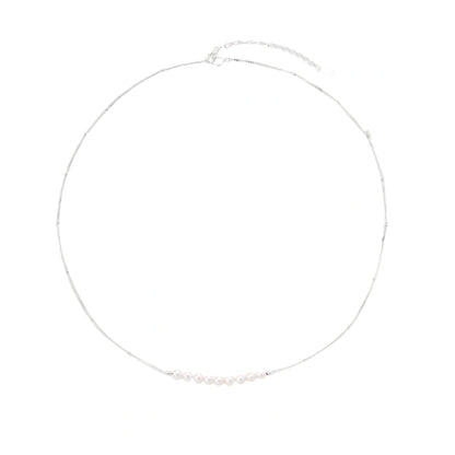 Silver necklace with small pearls on a white background
