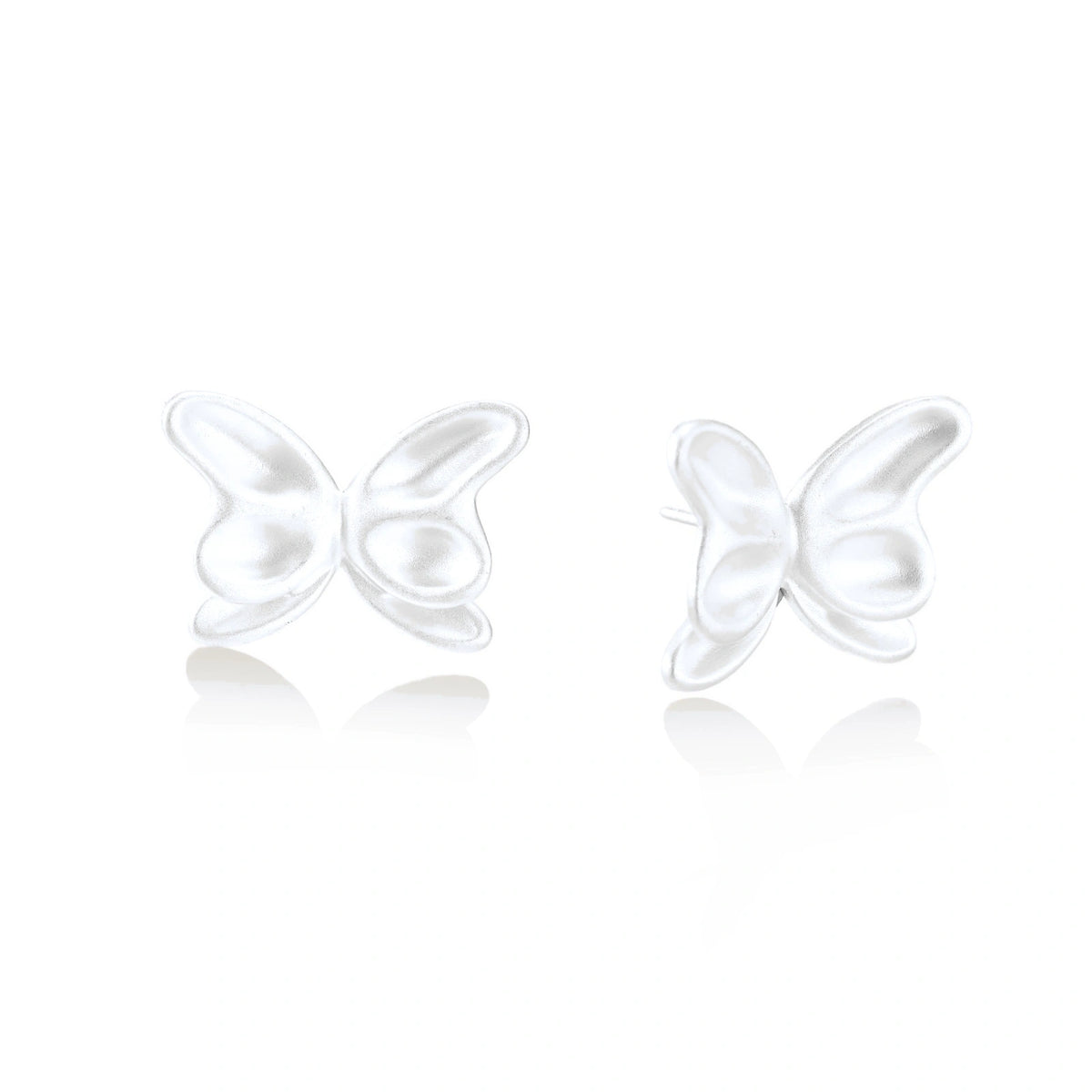 Sylvie Butterfly Studs, pair of matte sterling silver butterfly stud earrings, one front-on and one turned to show the post