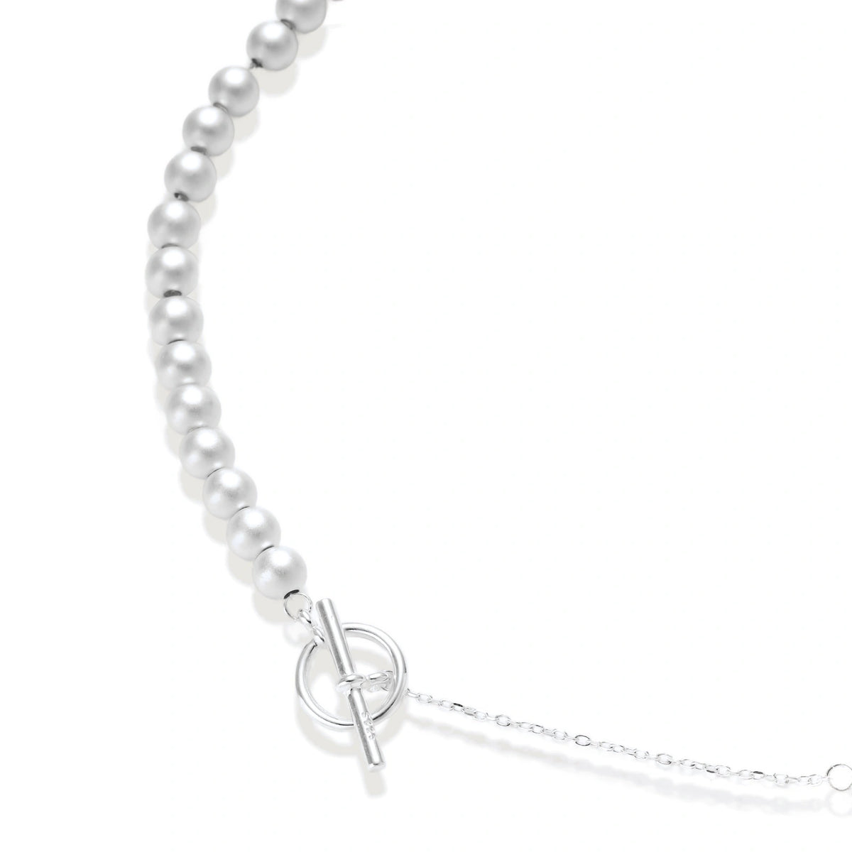 Della Sphere Necklace, close view of graduated brushed silver spheres and the toggle clasp on a fine chain
