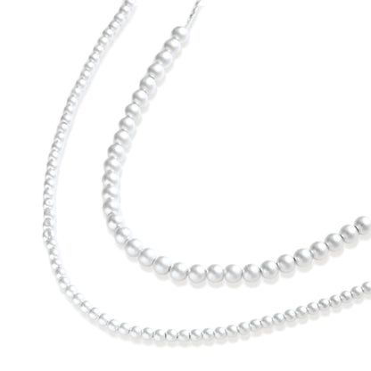 Della Sphere Necklace, necklace doubled to show two layers of graduated spheres