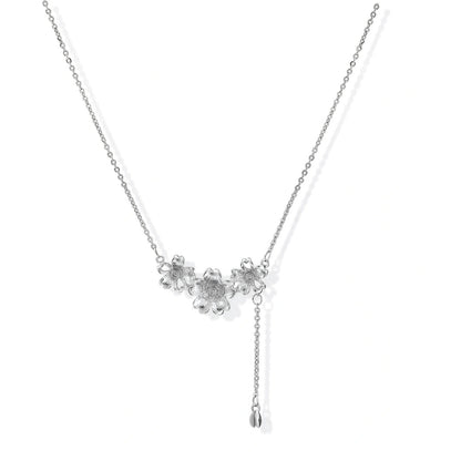 Silver Bloom Lariat necklace in white gold plated brass with sculpted flower blossoms