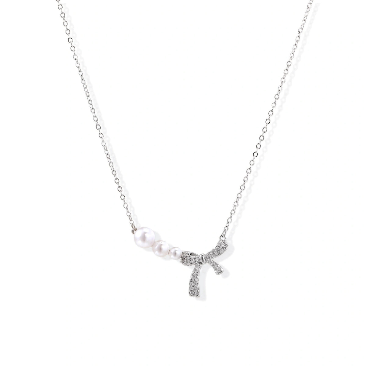 Pearl Bow Necklace - White Gold Plated Brass with freshwater pearls and pavé crystal bow