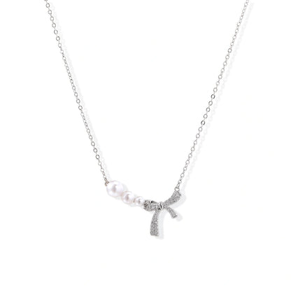 Pearl Bow Necklace - White Gold Plated Brass with freshwater pearls and pavé crystal bow