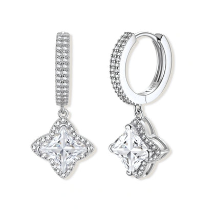 Delphine Star Moissanite Huggies, pair of pavé huggie hoops each with a square moissanite in a four-point star frame, front view