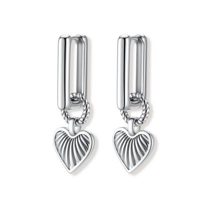 Ada Heart Huggies, pair of silver heart drop huggies showing the open rectangular hoop outline, front view