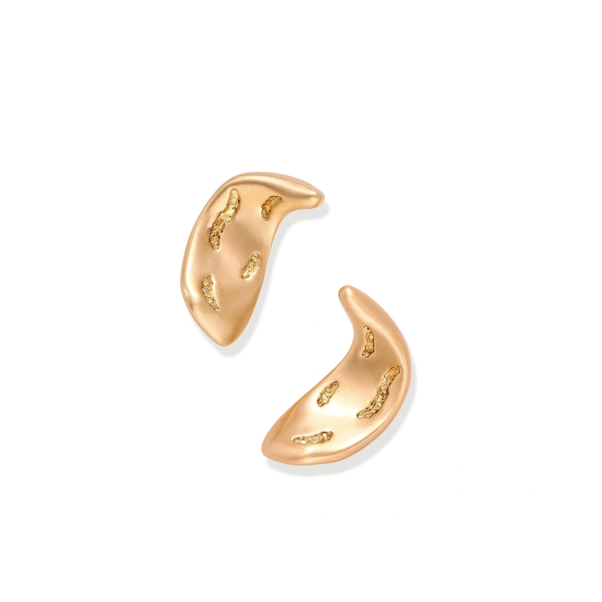 Calla Crescent Earrings, pair laid at an angle showing the curved sculptural form