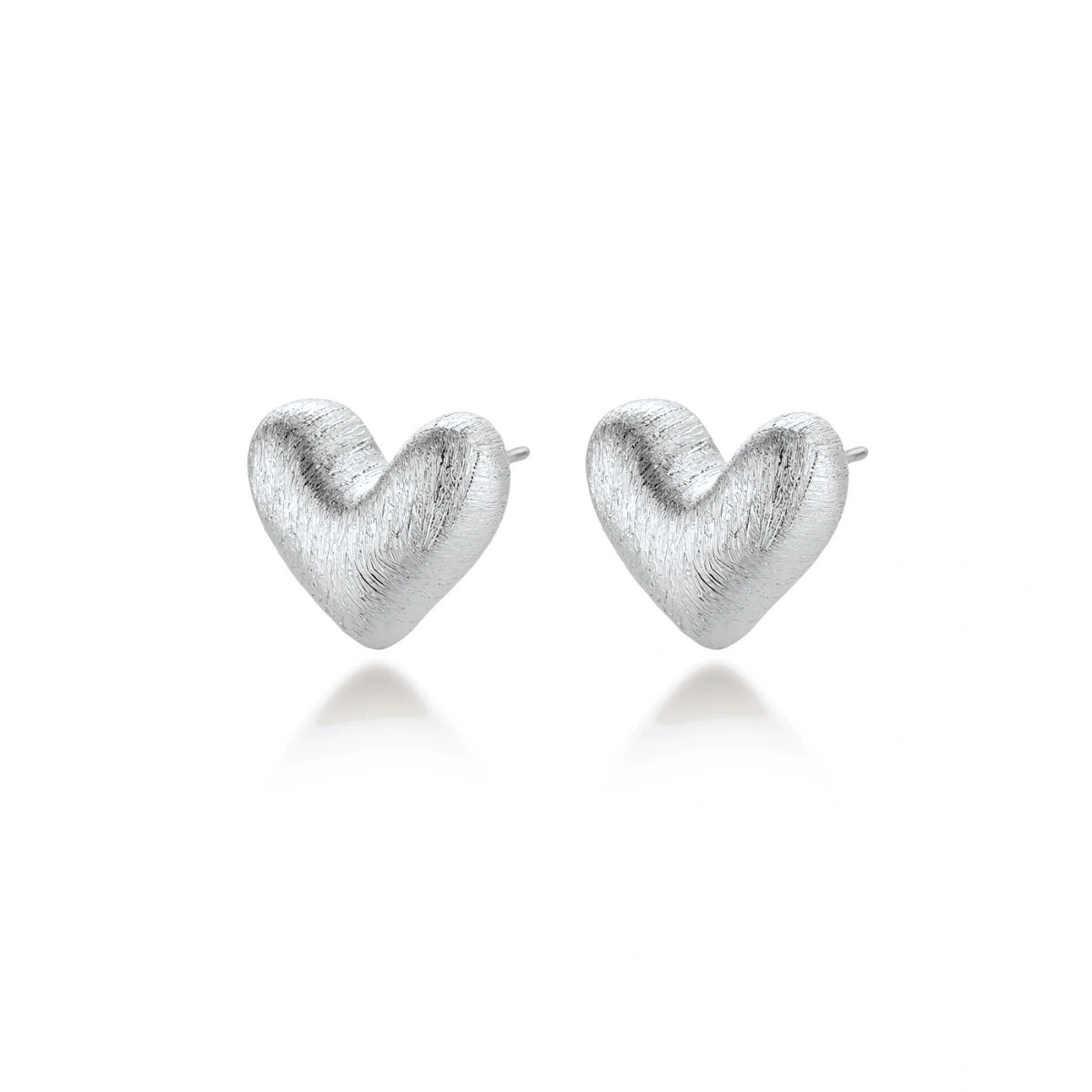 Hazel Silver Heart Studs, pair angled to show the rounded heart profile and posts
