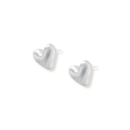 Hazel Silver Heart Studs, pair lying flat showing the post backs