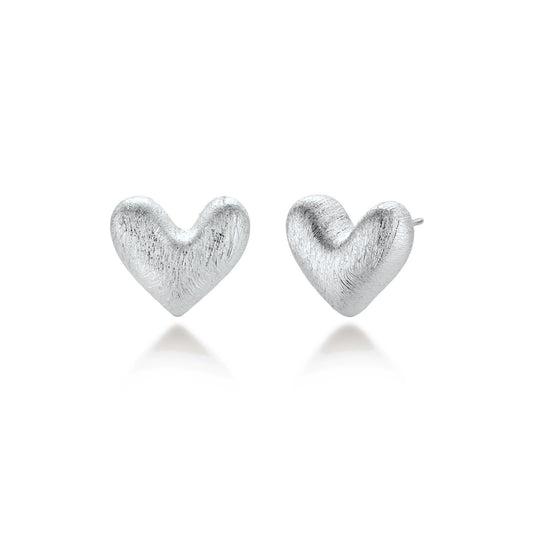 Hazel Silver Heart Studs, pair of brushed silver puffed heart stud earrings, one front-on and one turned to show the post