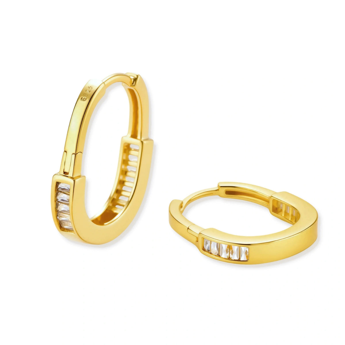 Maren Baguette Huggies, pair of slim oval gold huggie hoops with a channel-set row of baguette cubic zirconia, one upright and one lying flat