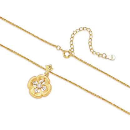 Fleur Pendant Necklace, necklace laid flat showing the brushed petal pendant, the fine chain and the spring-ring clasp with extender