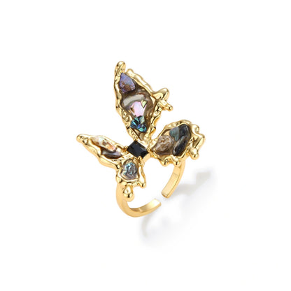 Marina Butterfly Ring in gold-tone brass with abalone-toned shell pearl inlay and black baguette stone