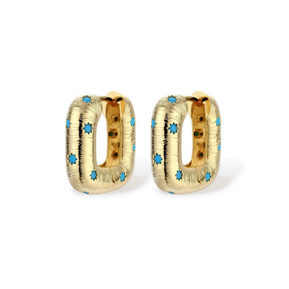 Nova Celestial Hoops pair standing upright showing ribbed gold-tone texture