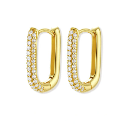 Gold hoop earrings with clear stones on a white background