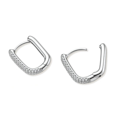 Silver hoop earrings with small stones on a white background