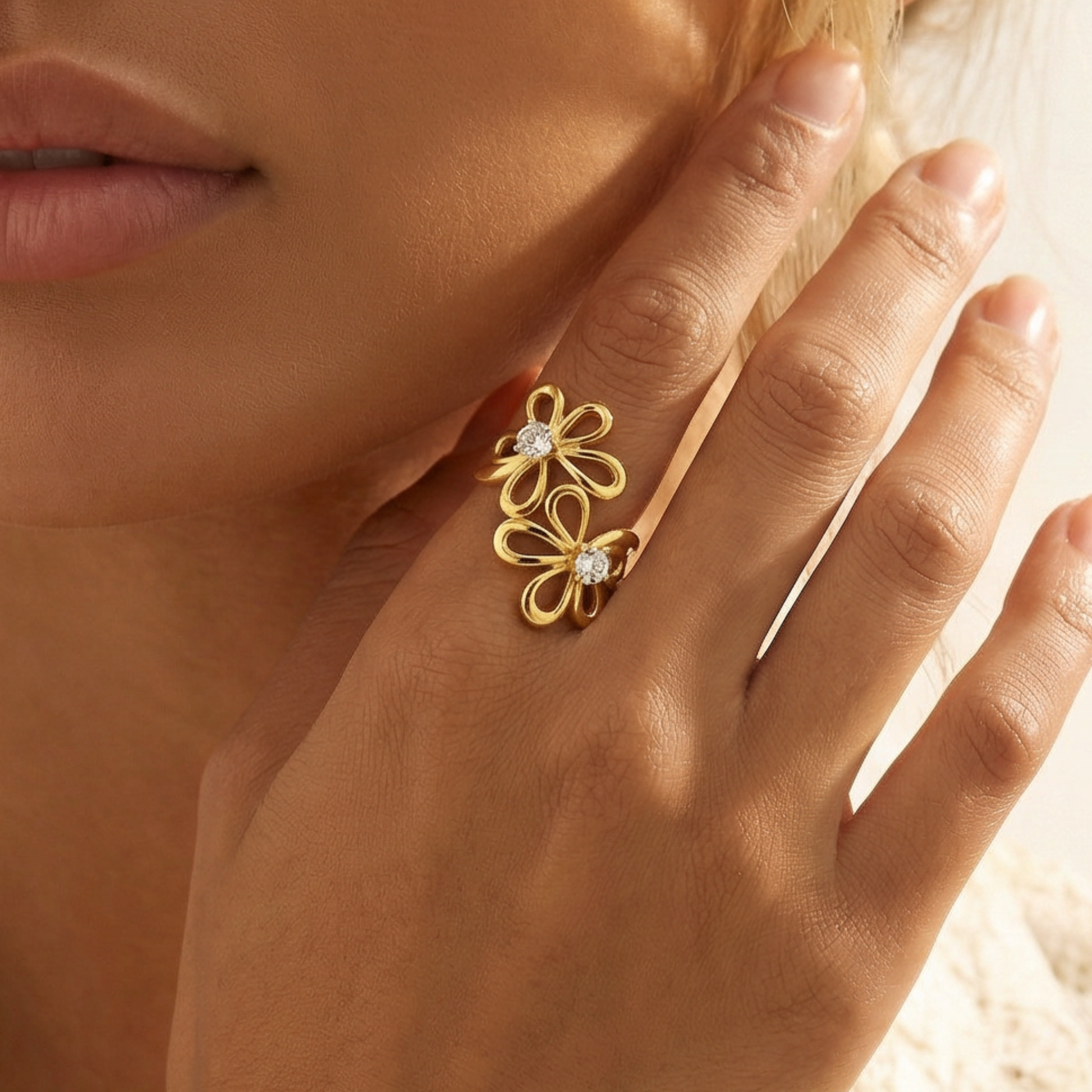 Gold floral ring with diamonds on a hand