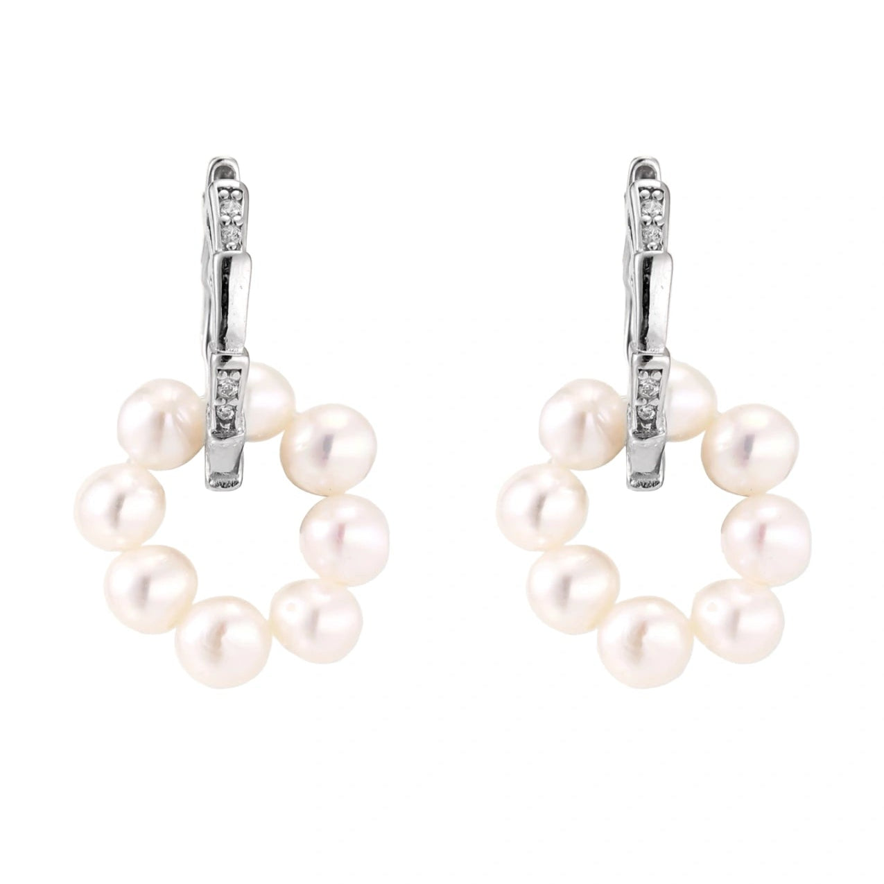 Pearl earrings with silver hooks on a white background