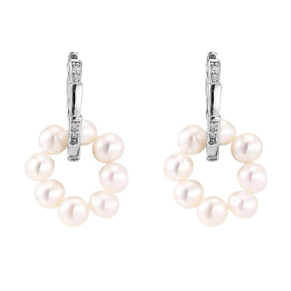 Pearl earrings with silver hooks on a white background