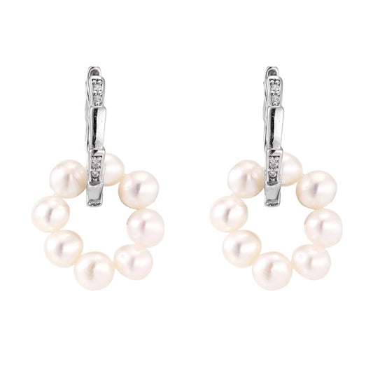 Pearl earrings with silver hooks on a white background