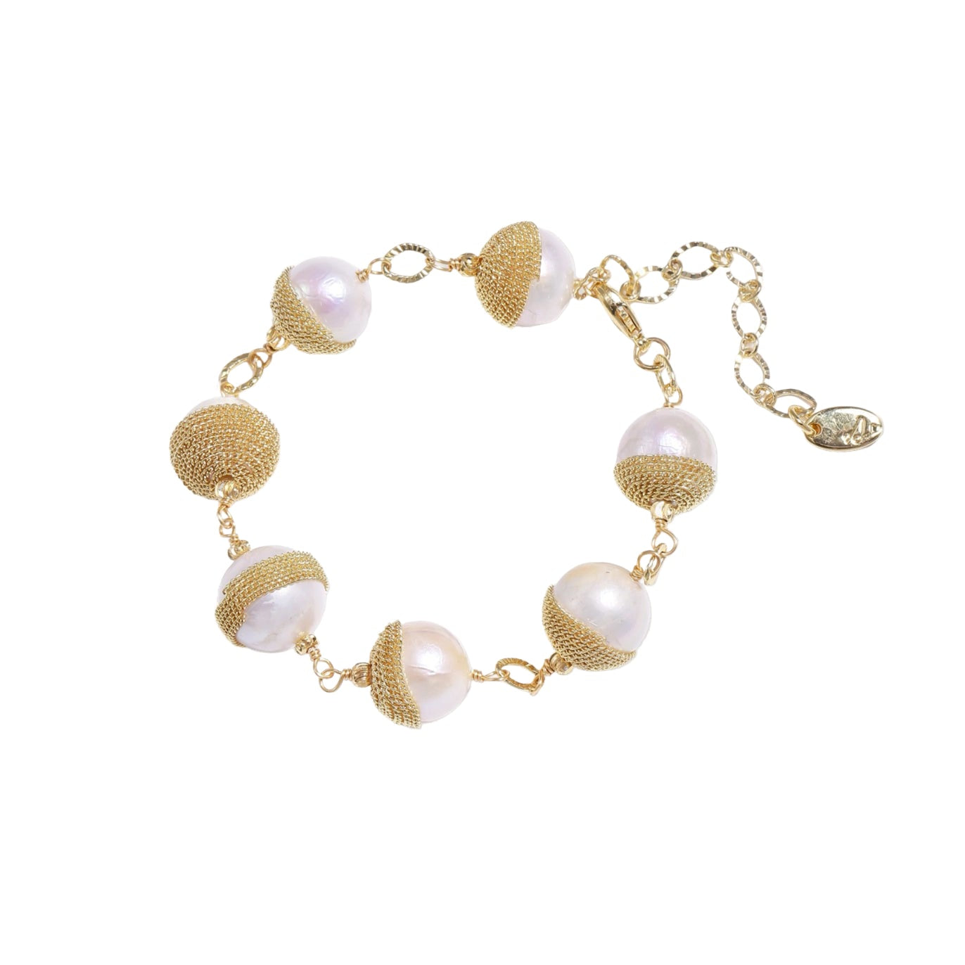 Gold and pearl bracelet on a white background
