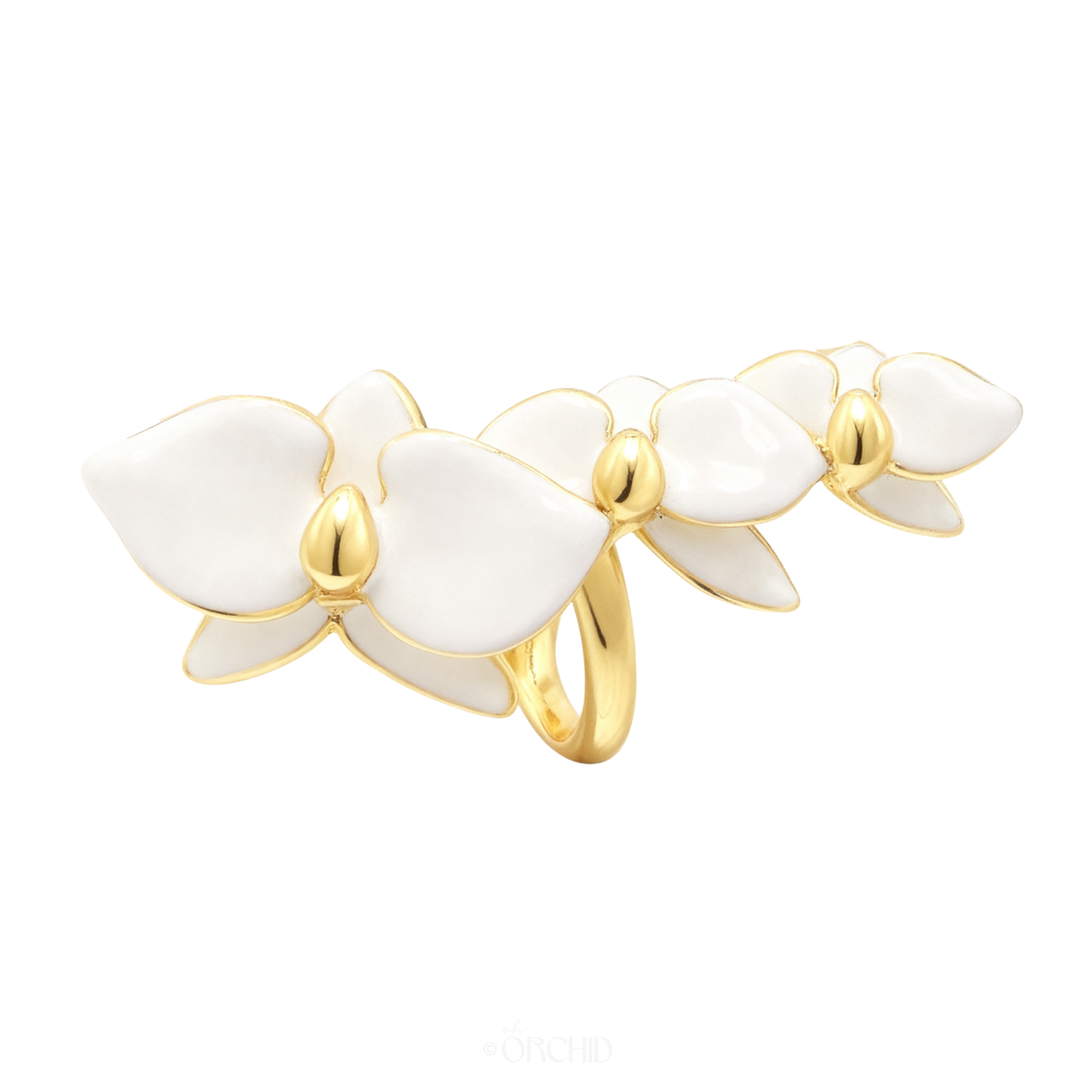 Gold ear cuff with white floral orchid design on a white background