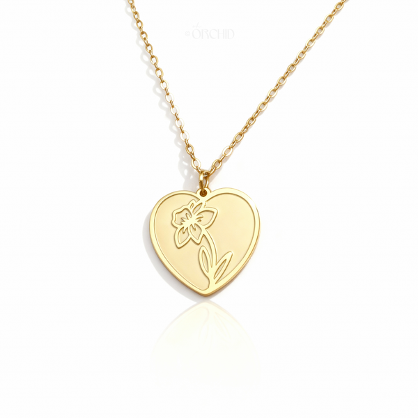 Gold birth flower heart pendant necklace on white background