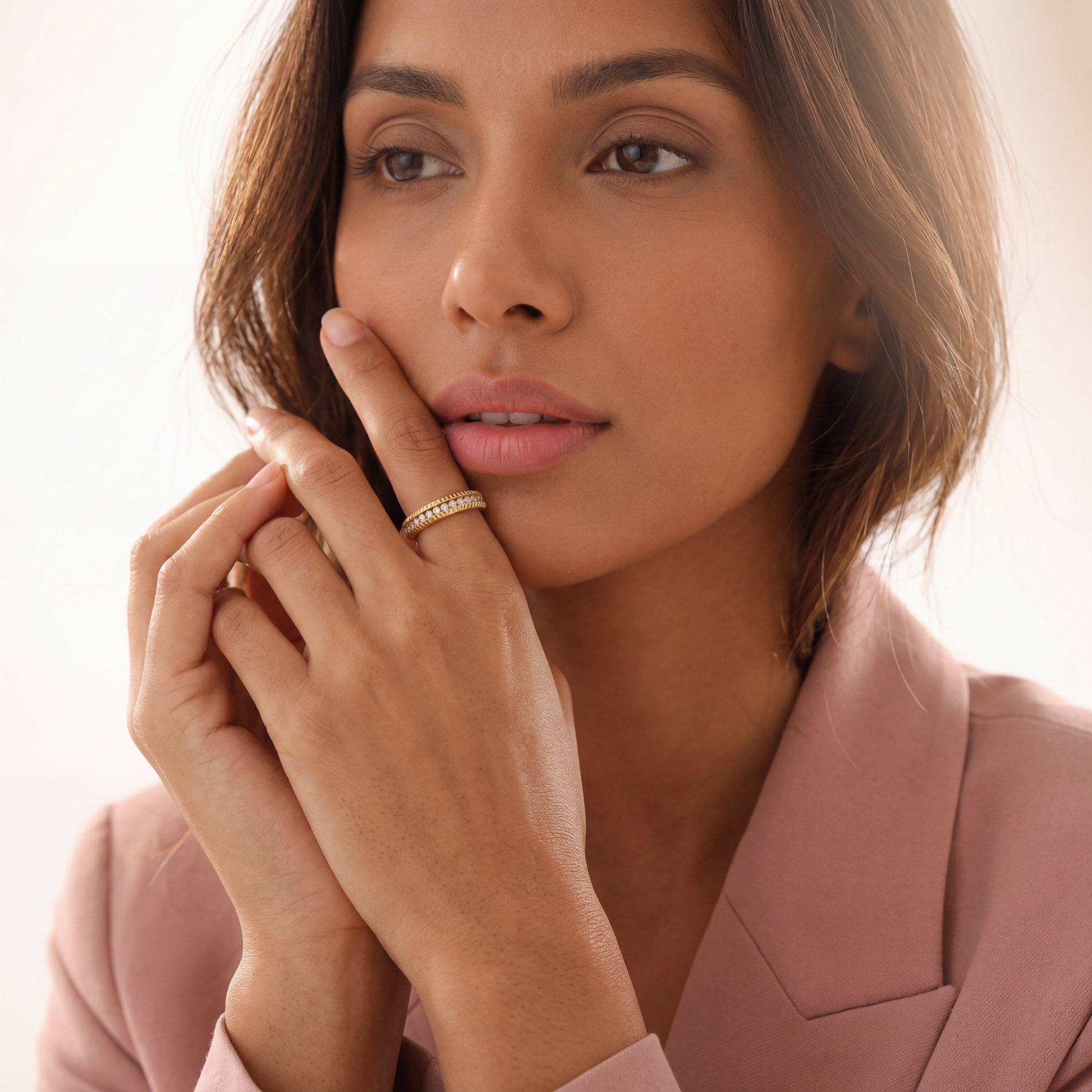 Woman wearing a ring with a blurred background